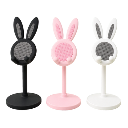 Black, pink, and white cute bunny phone stands on a pure white background