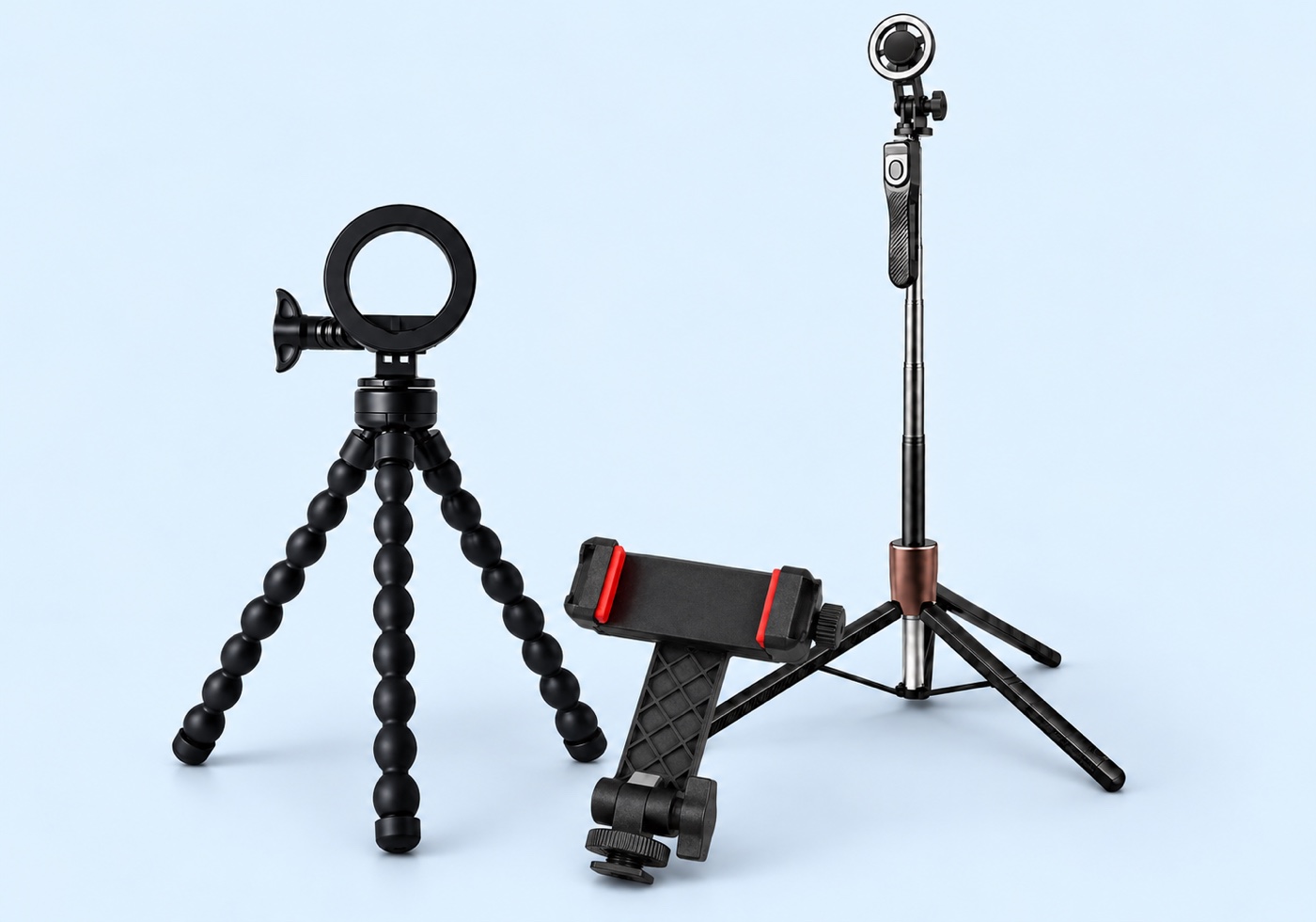 Telescopic magnetic phone tripod, flexible mini tripod and KY18 cold shoe phone clamp grouped on a pale blue surface, composite render