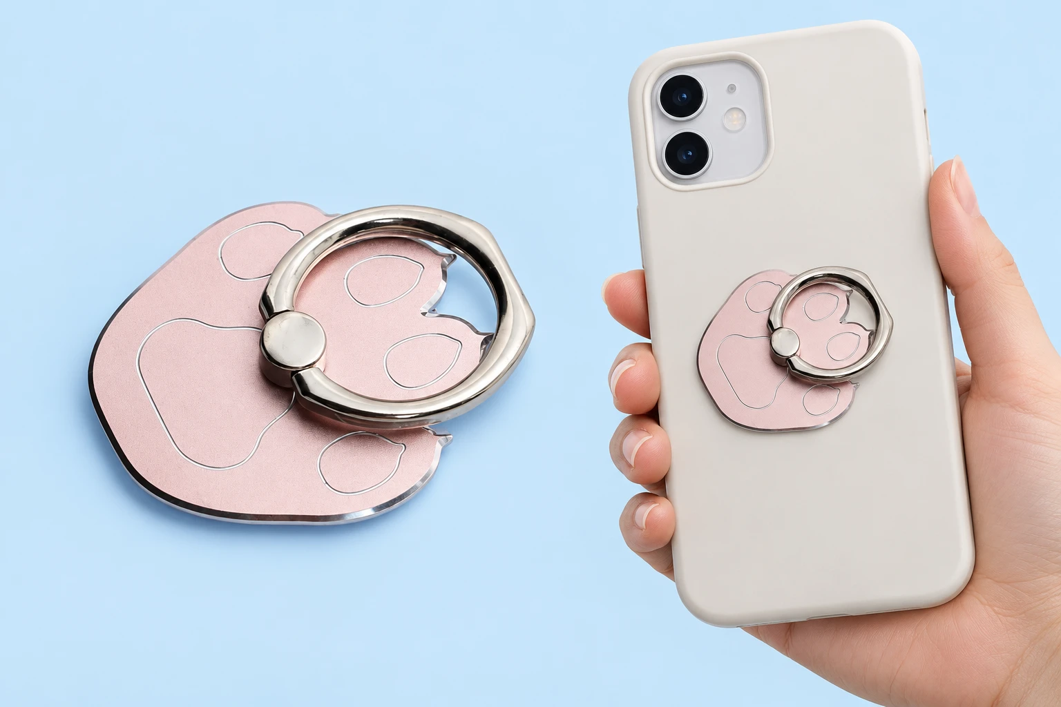 Rose-gold-tone broad-paw phone ring, complete and closed on a hand-supported phone, with rear fixing hidden