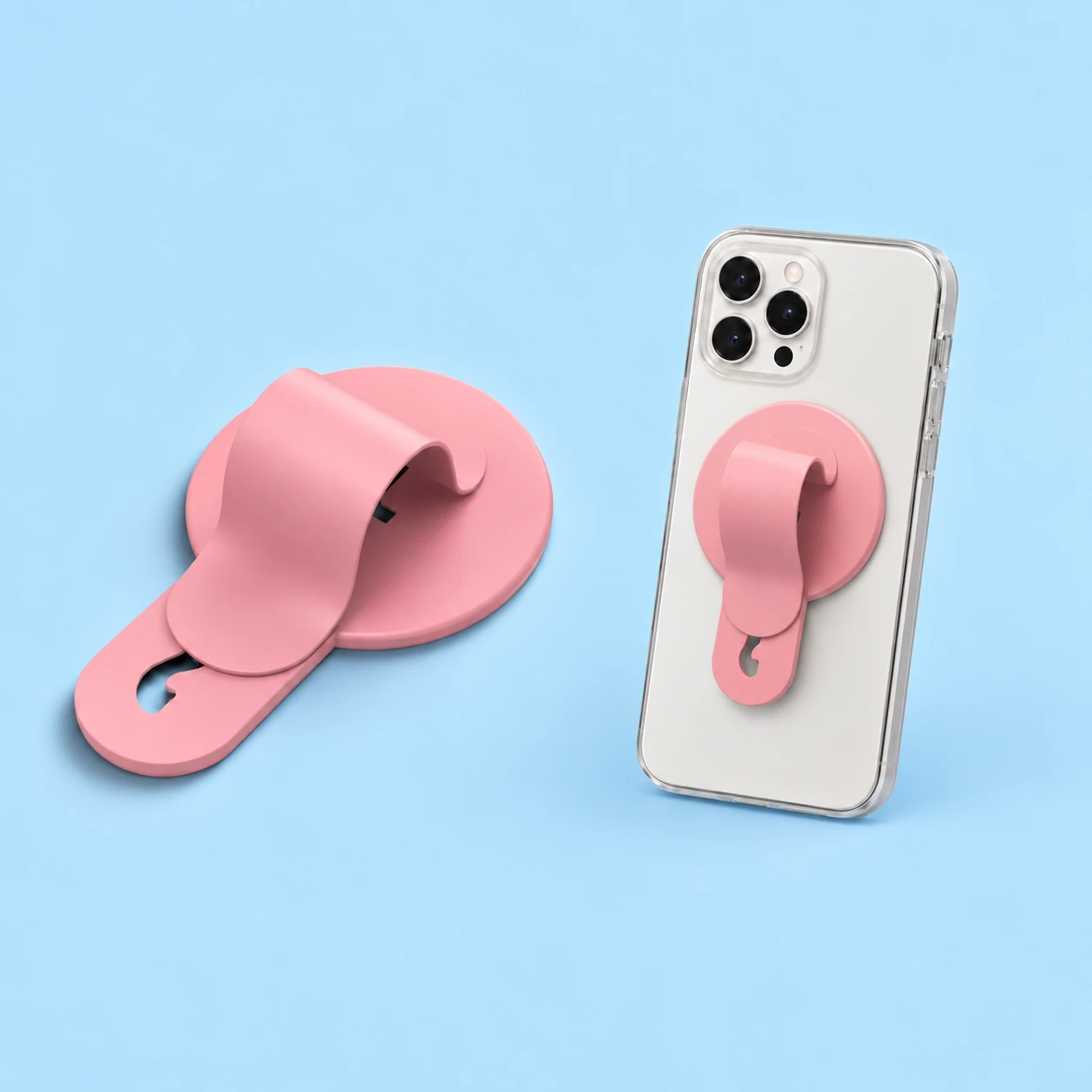 Pastel pink round-base sliding arch phone grip, complete and mounted on a phone case, square composition