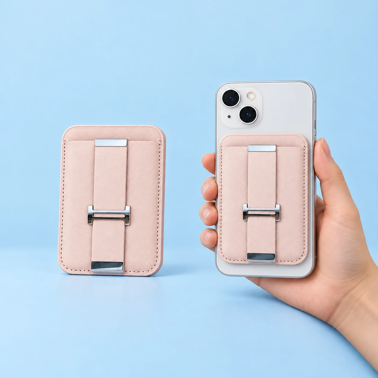 Pale pink magnetic wallet phone stand with flat strap and H-shaped coupler, shown closed on phone, square composition