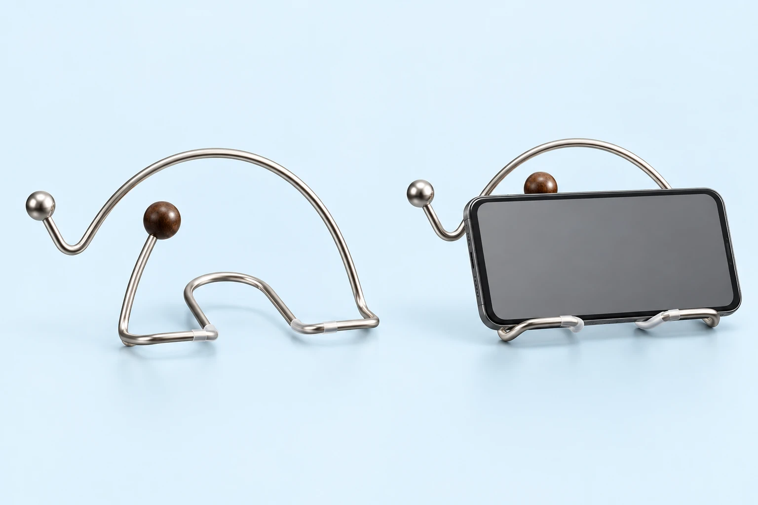 Silver wire elephant desktop stand with brown ball accent and landscape phone support illustration