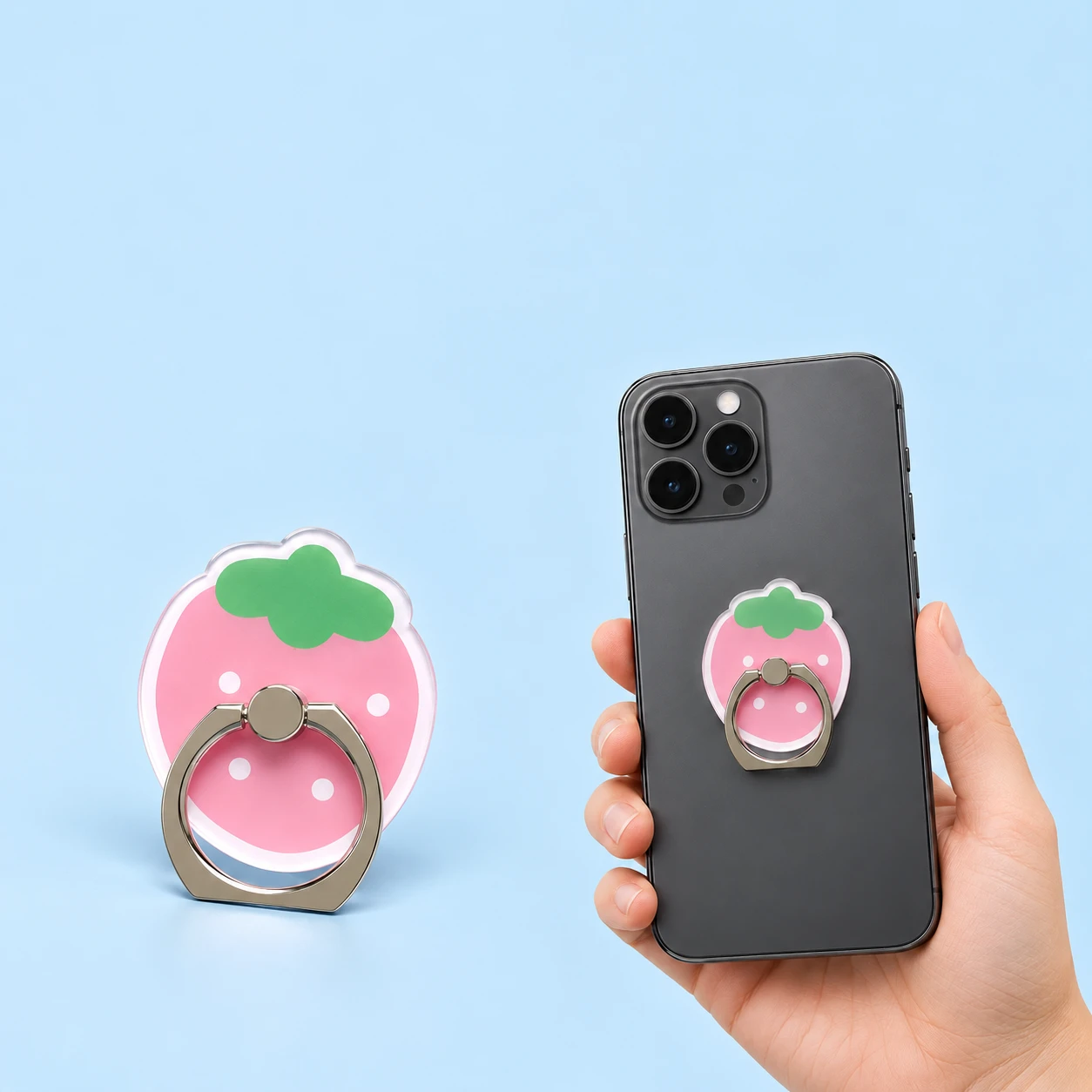 Pink strawberry cutout phone ring holder, with illustrative closed placement on a phone case, square composition