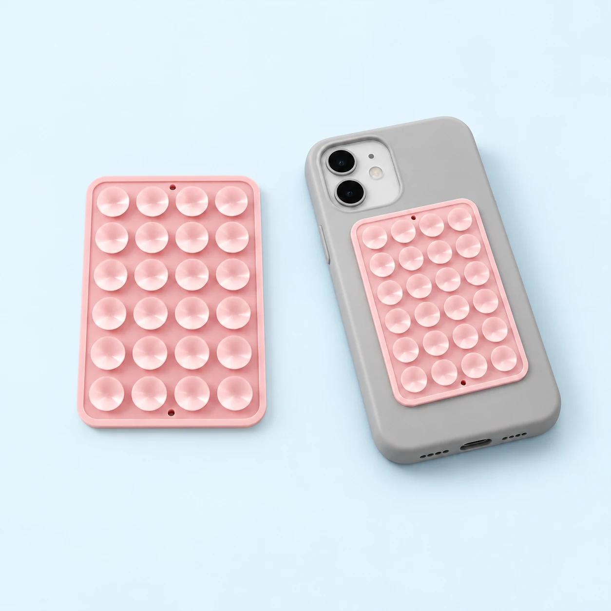 Pale pink 24-cup adhesive-backed phone pad with phone-back placement illustration, square composition