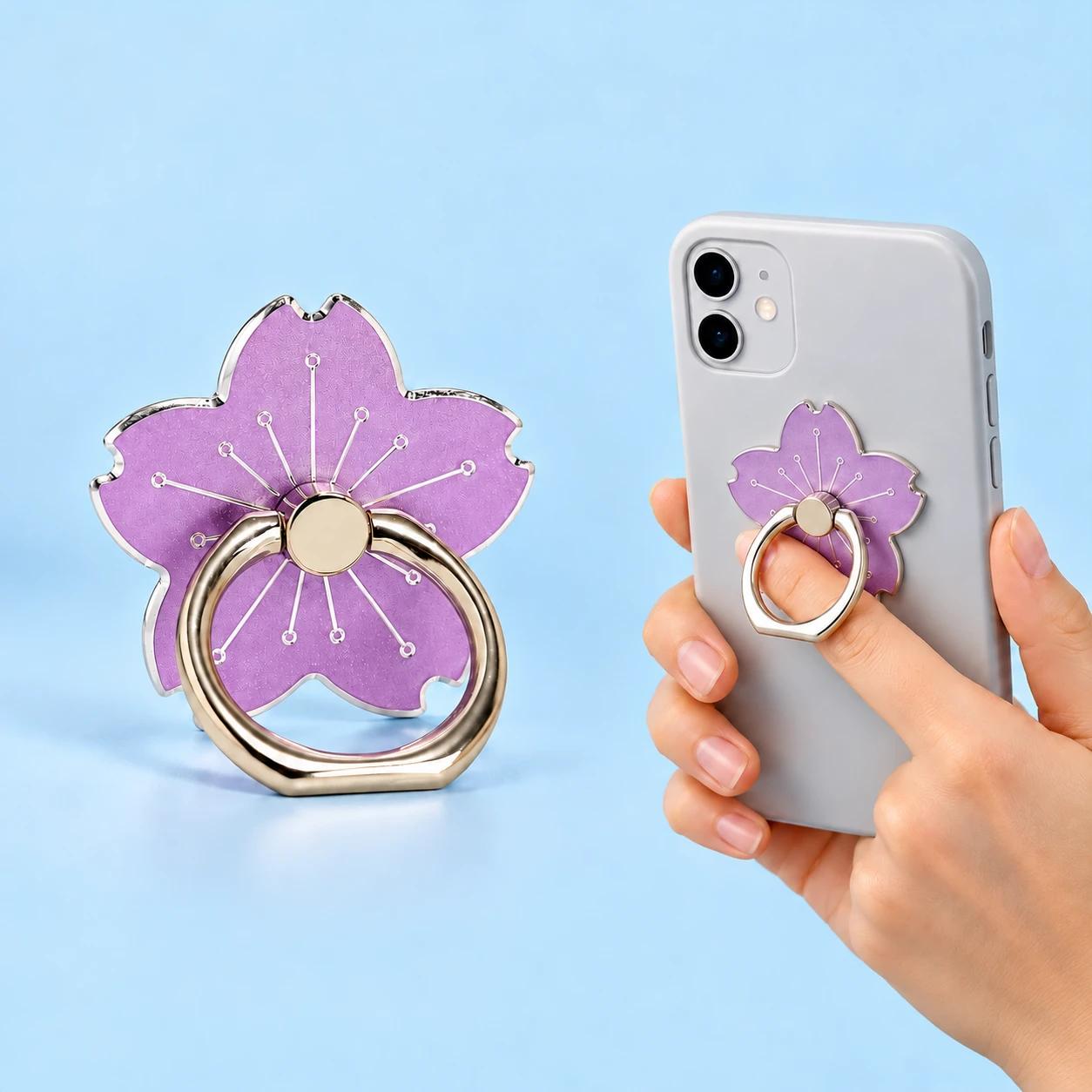 Lilac cherry blossom hinged phone ring holder with illustrated finger-loop use, square composition