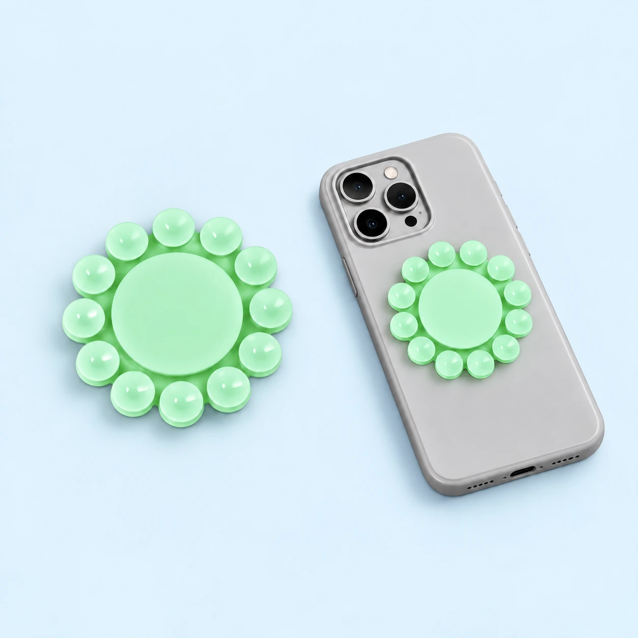 Mint sunflower phone pad with a blank circular center and twelve surrounding suction cups, square composition