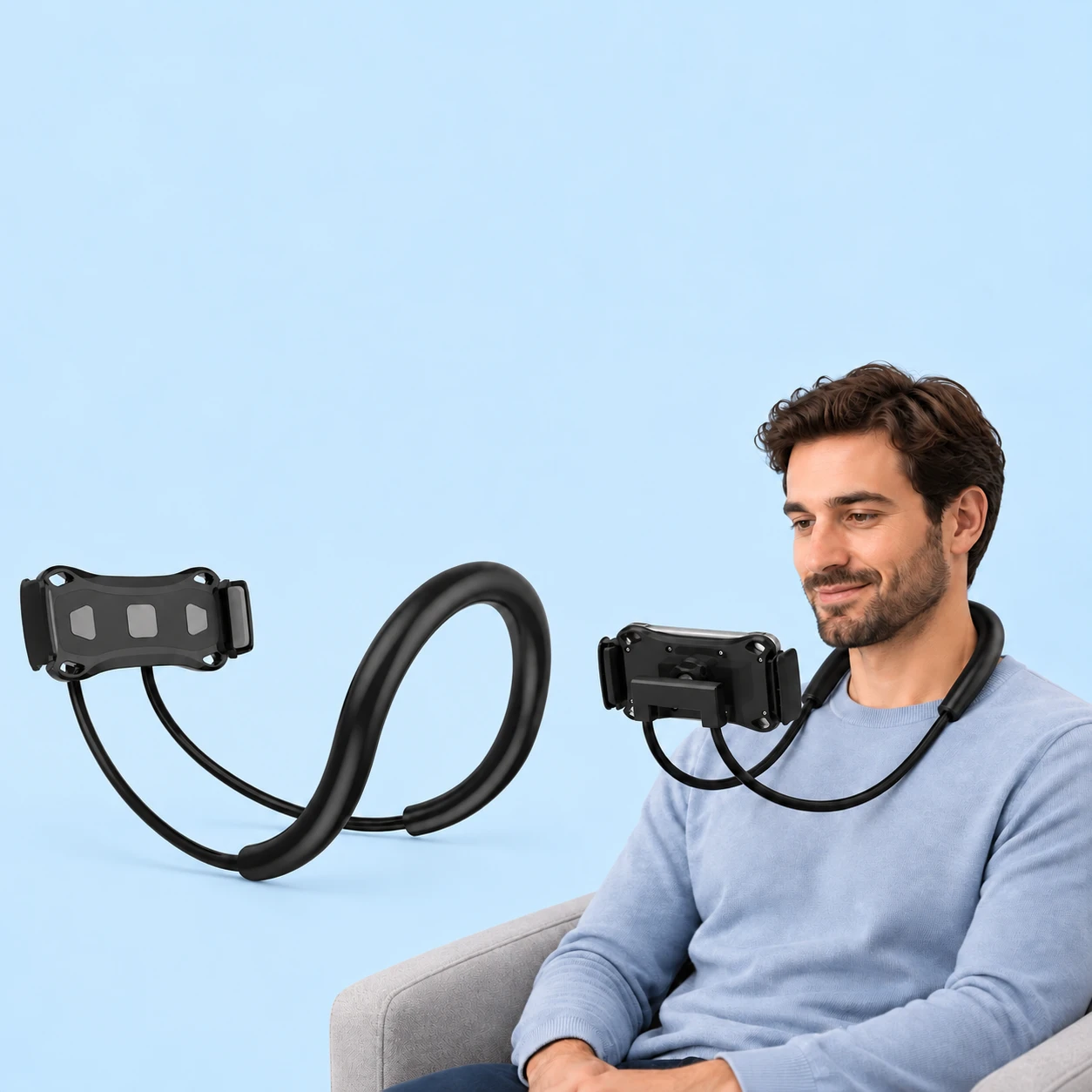 Complete black twin-arm neck phone holder with its broad clamping cradle at left; the same original padded neck U, two arms, rear U bridge and central joint hold a landscape phone during illustrated stationary seated use at right, against pale blue. Phone and chair are not included., square composition