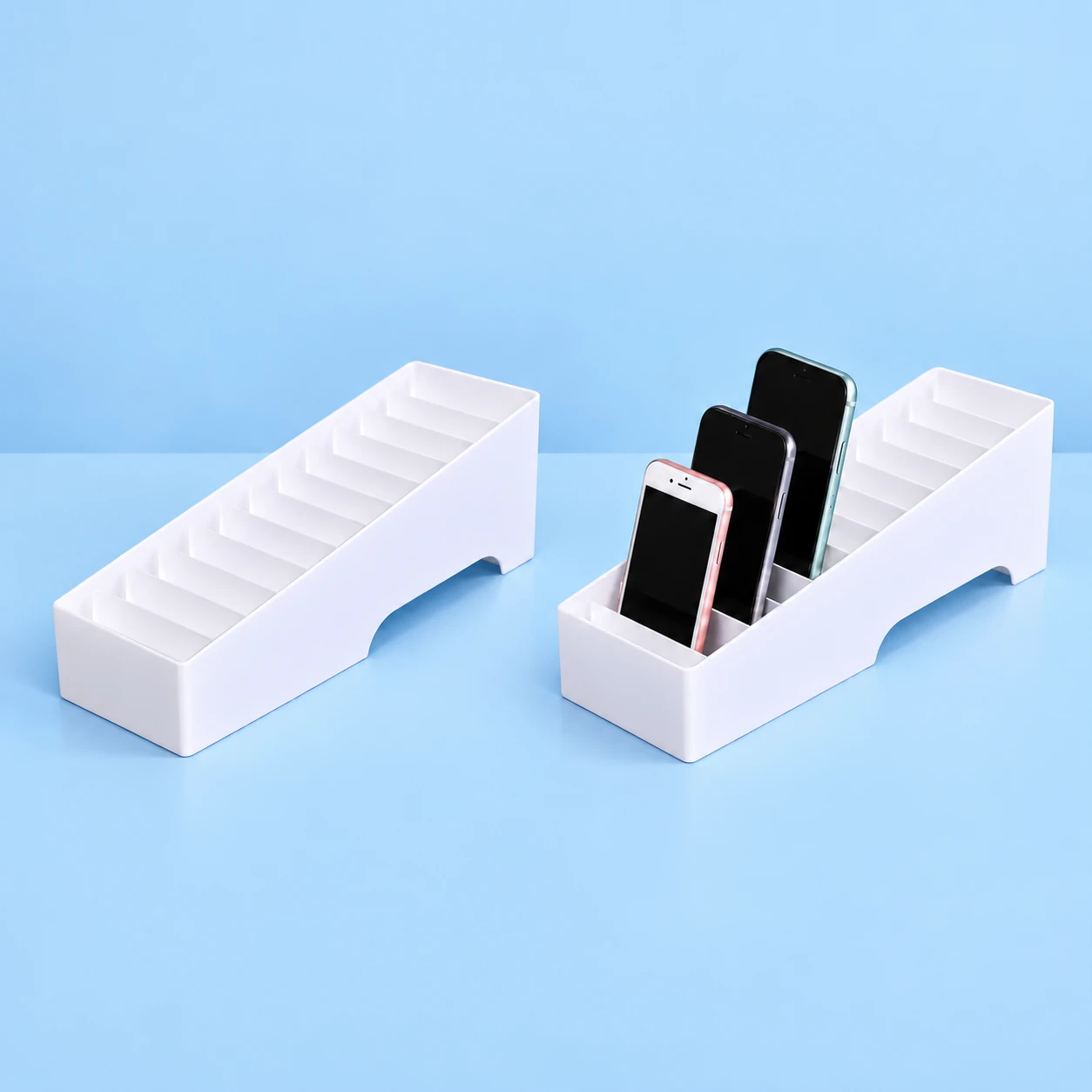 White Twelve-Slot Sloped Phone Rack; product and illustrative use on pale blue. Phone and scene props excluded., square composition