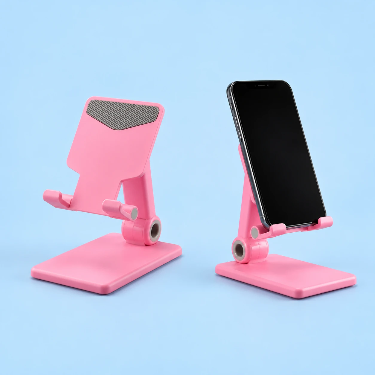 Pastel pink curved-arm folding phone stand, isolated and supporting a portrait phone, square composition