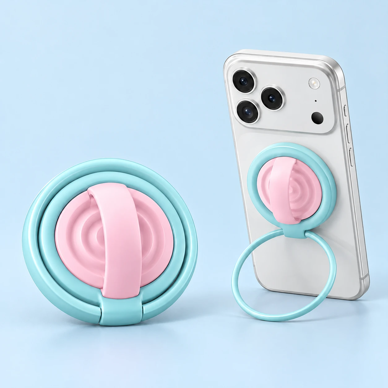 Cyan outer phone ring with pink ridged center and arched band, shown complete and in documented compatible magnetic-phone support use.