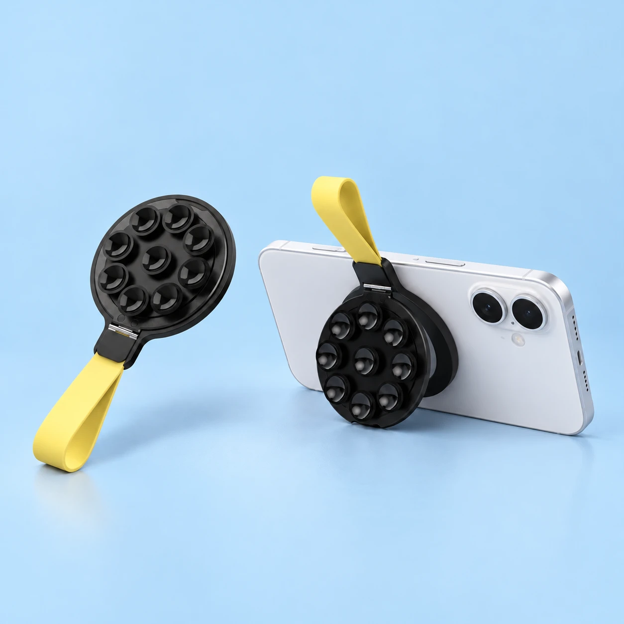Black and yellow complete nine-cup folding phone kickstand at left; same holder supporting a landscape phone on a tabletop at right. Phone is not included., square composition
