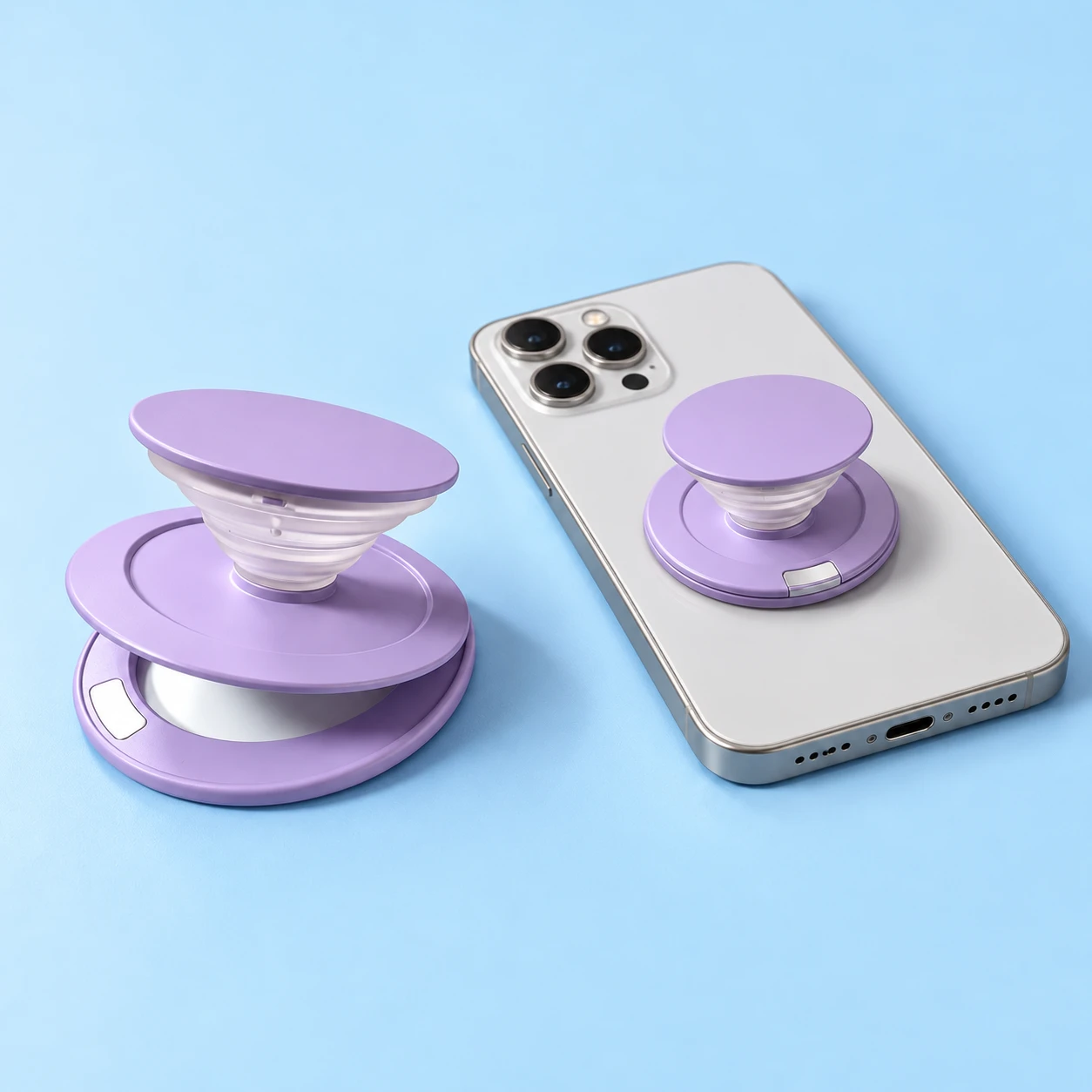 Lilac expandable phone grip with hinged mirror plate and open-ring magnetic base, shown alone and mounted on a phone, square composition