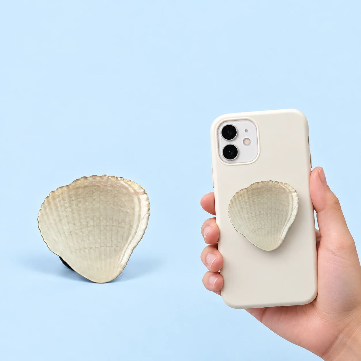 Cream shell-shaped printed phone grip shown alone and closed on a phone case, square composition