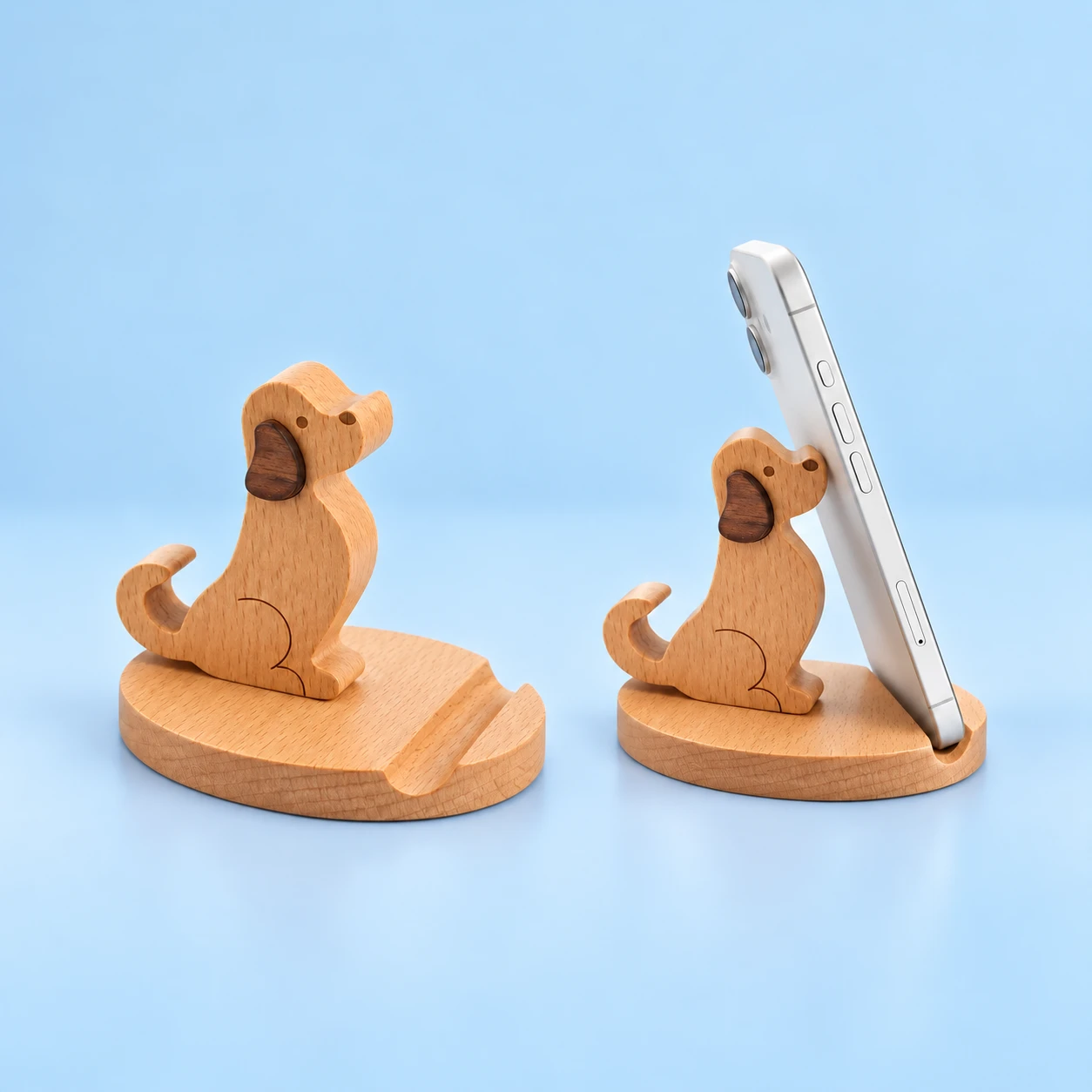 Seated curly-tail wooden dog phone stand and portrait phone resting in its base groove, square composition