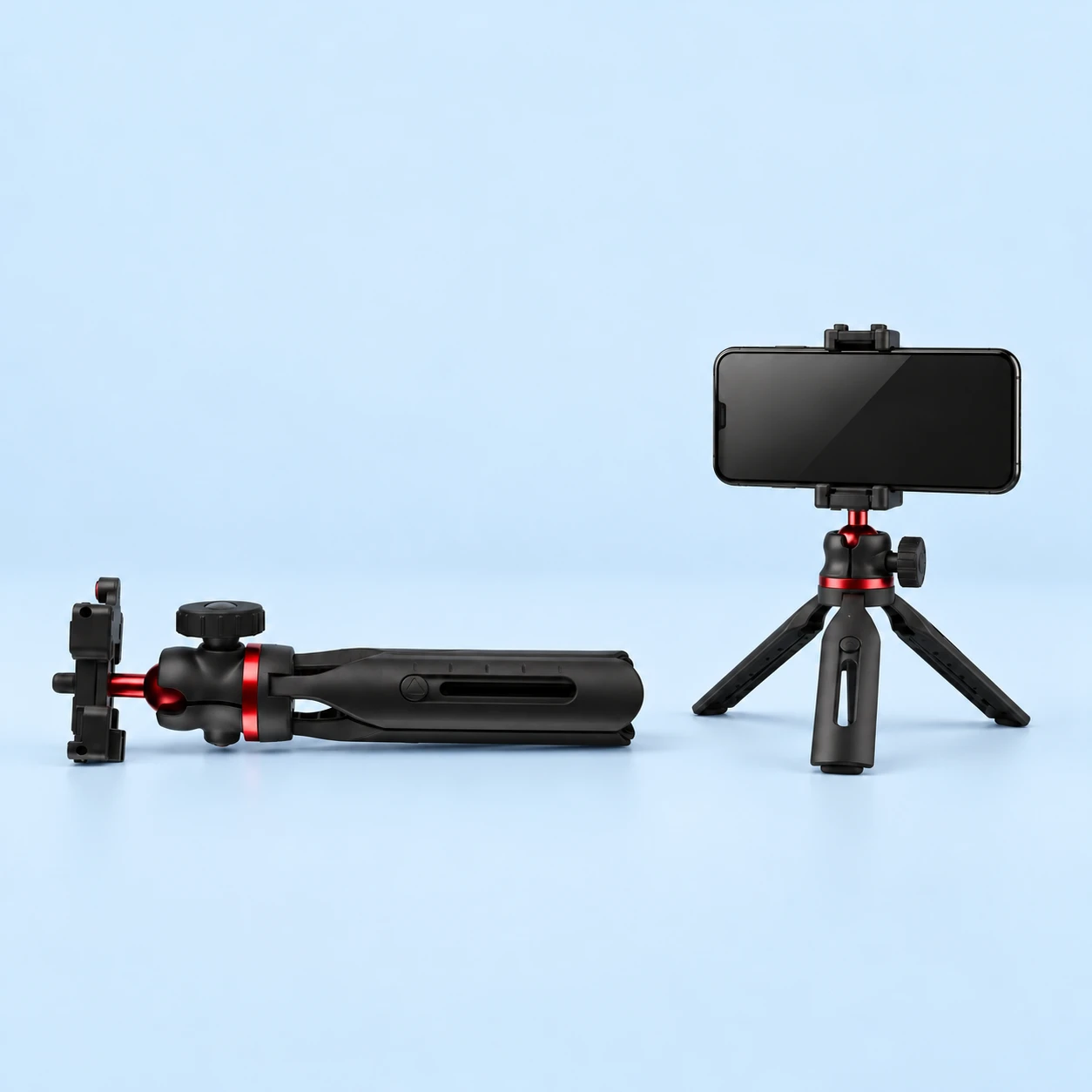 Black GM-2 Sliding-Leg Mini Phone Tripod; product and illustrative use on pale blue. Phone and scene props excluded., square composition