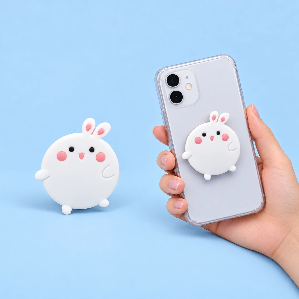 Round white bunny phone grip shown alone and closed on a phone back, square composition