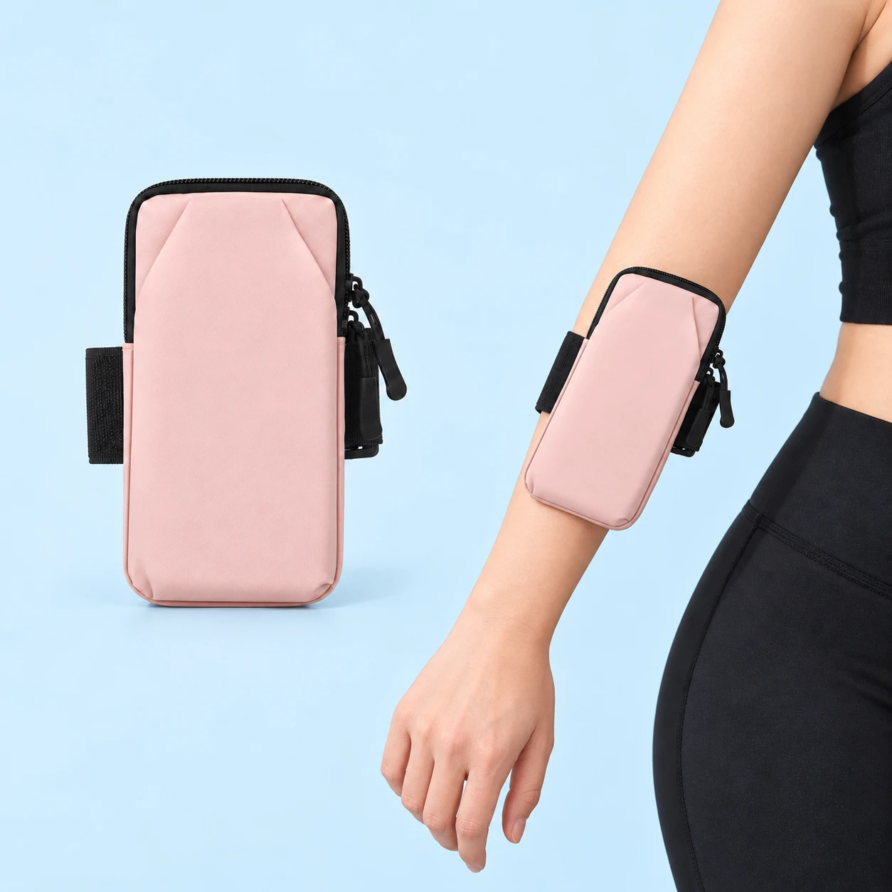 Pastel pink envelope-panel phone arm pouch shown alone and worn closed on a forearm, square composition