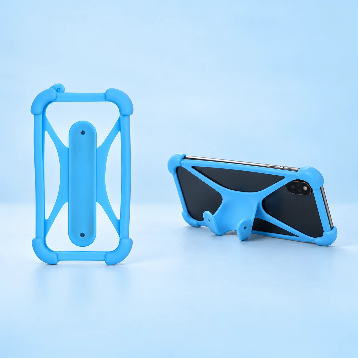 Sky-Blue Four-Corner Phone Harness with Curved Rear Stand; product and illustrative use on pale blue. Phone and scene props excluded., square composition