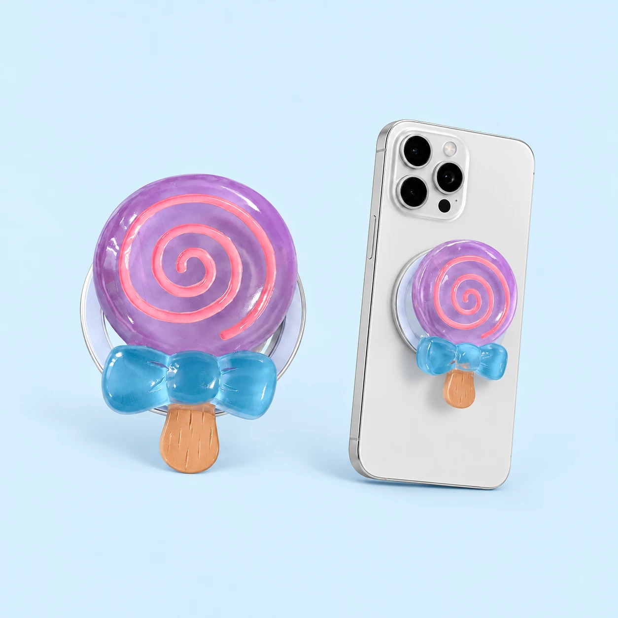 Lilac spiral lollipop phone grip with pink spiral, blue bow and circular backing, square composition