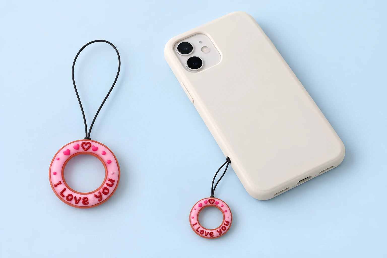Pink lettered donut finger-loop phone lanyard and case-hole attachment illustration