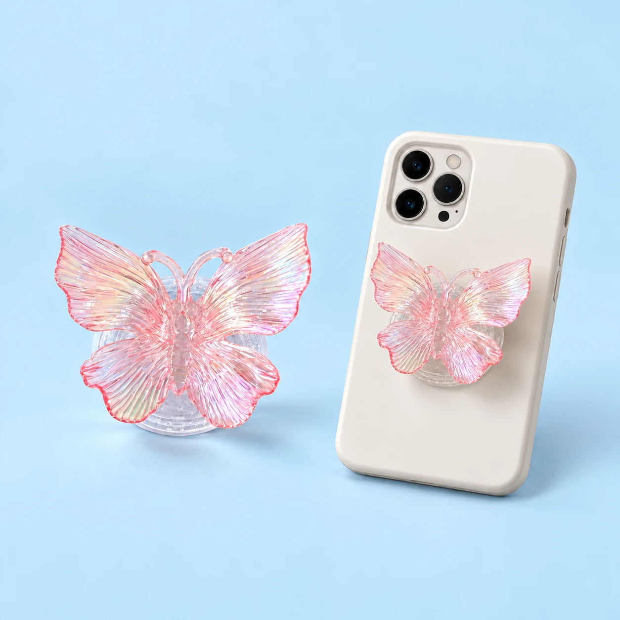 Pastel pink ridged butterfly phone grip with plain transparent base and conservative closed phone-back placement, square composition
