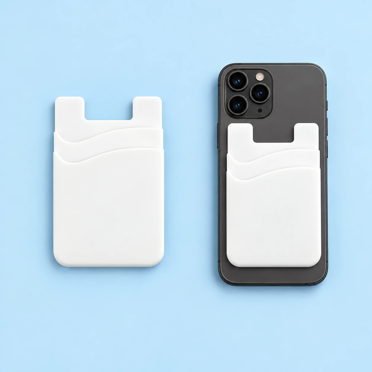 White two-tier phone card pocket with two curved openings and a U-notched top, shown empty on the left and flat on a stationary phone back on the right against a pale-blue background., square composition
