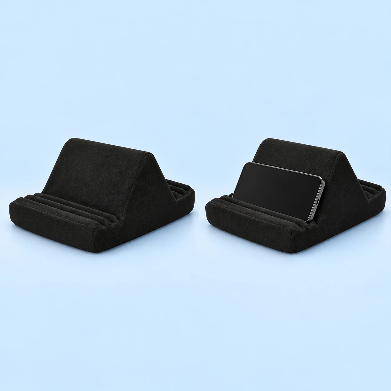 Black multi-groove foam phone reading cushion, shown complete and with an illustrative landscape phone resting in an original support channel; phone not included, square composition