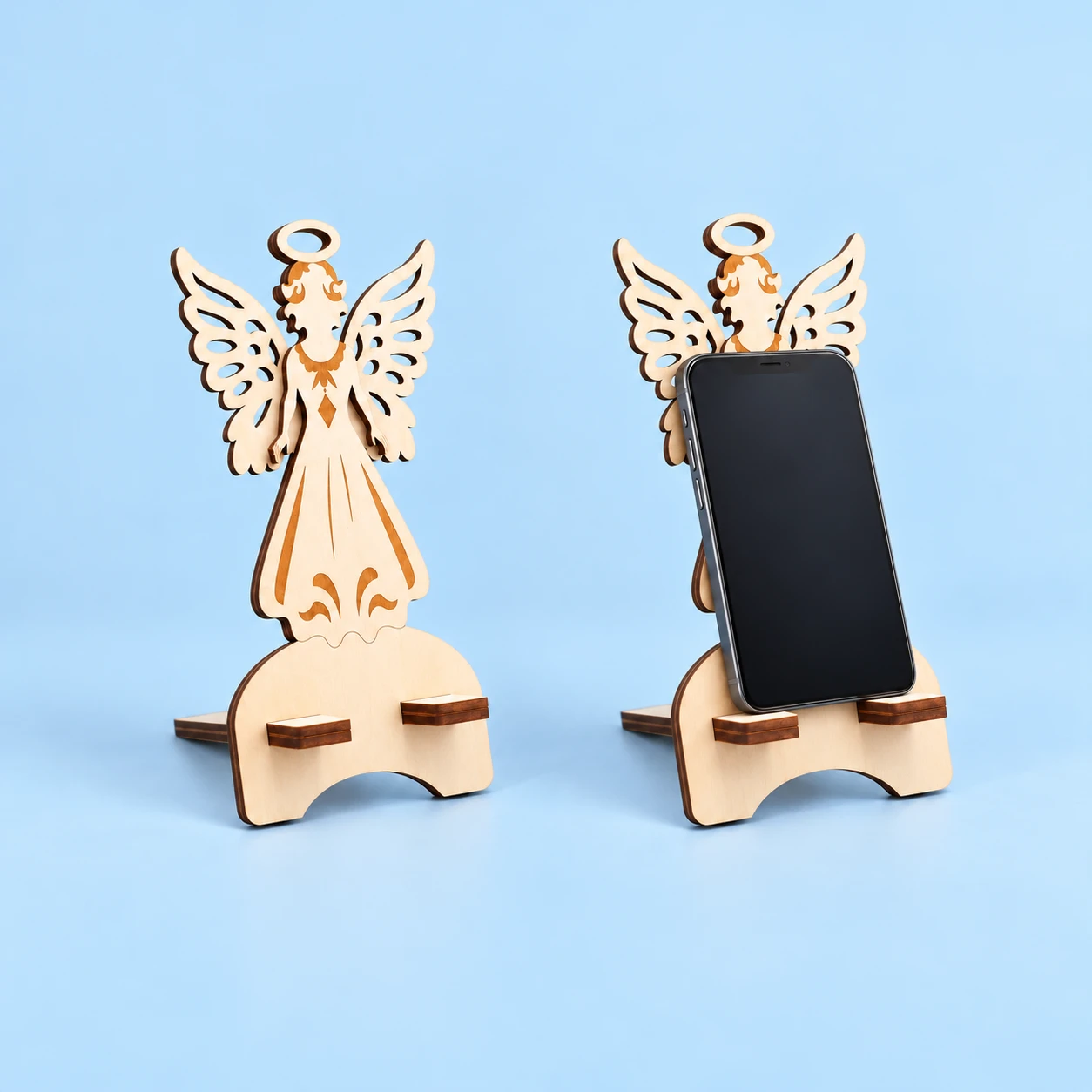 Winged angel wooden phone stand with flat support tabs and illustrative portrait phone use, square composition