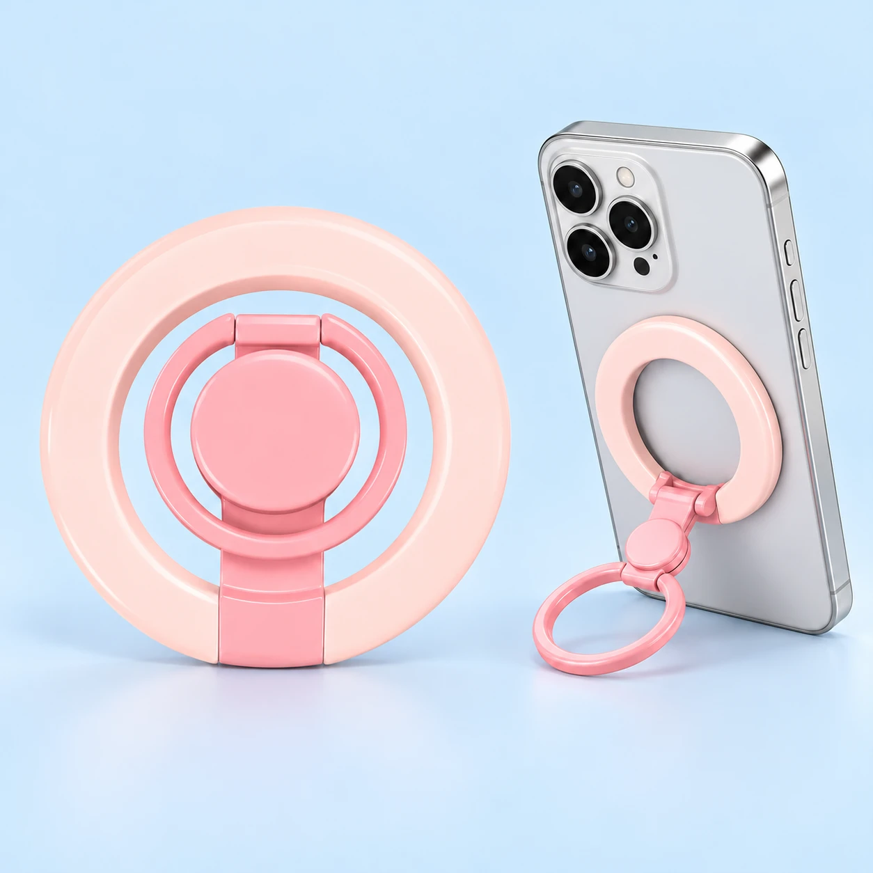 Pink dual-ring magnetic phone grip with central disc, complete product and source-supported phone use