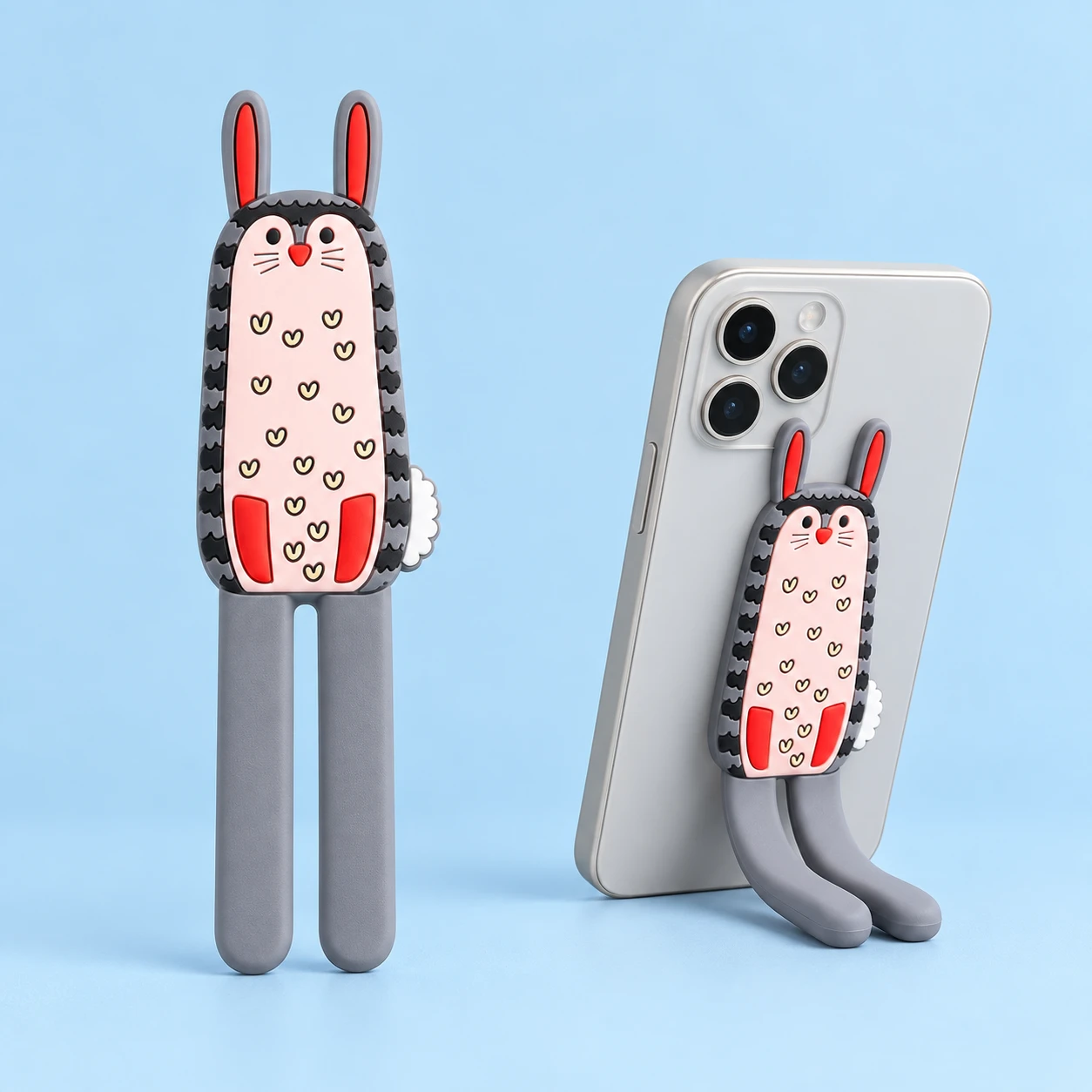 Gray Long-Eared Rabbit Bendable Phone Kickstand, complete product left and portrait phone support right on pale blue; phone not included
