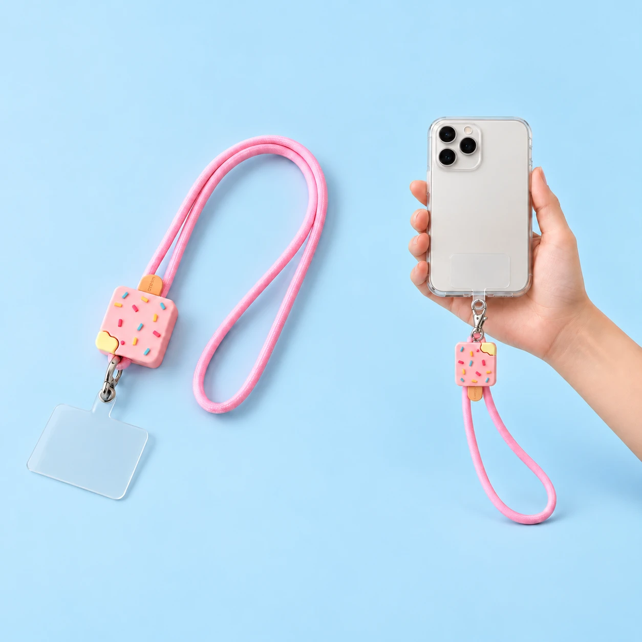 Pink sprinkle popsicle phone lanyard shown complete with included clear case tab and attached to a phone case, square composition