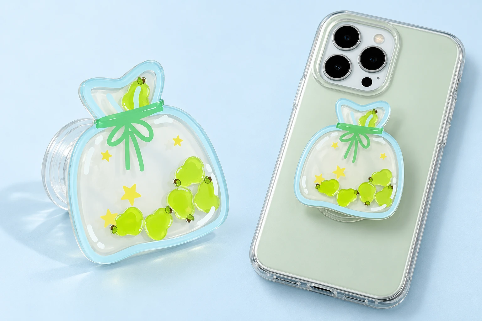 Green pear shaker-bag expandable phone grip with clear layered face and illustrative phone mounting