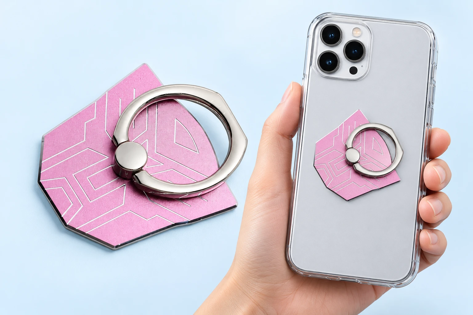 Pink angular-mask metal phone ring, complete and folded closed on a hand-supported phone with unseen rear attachment