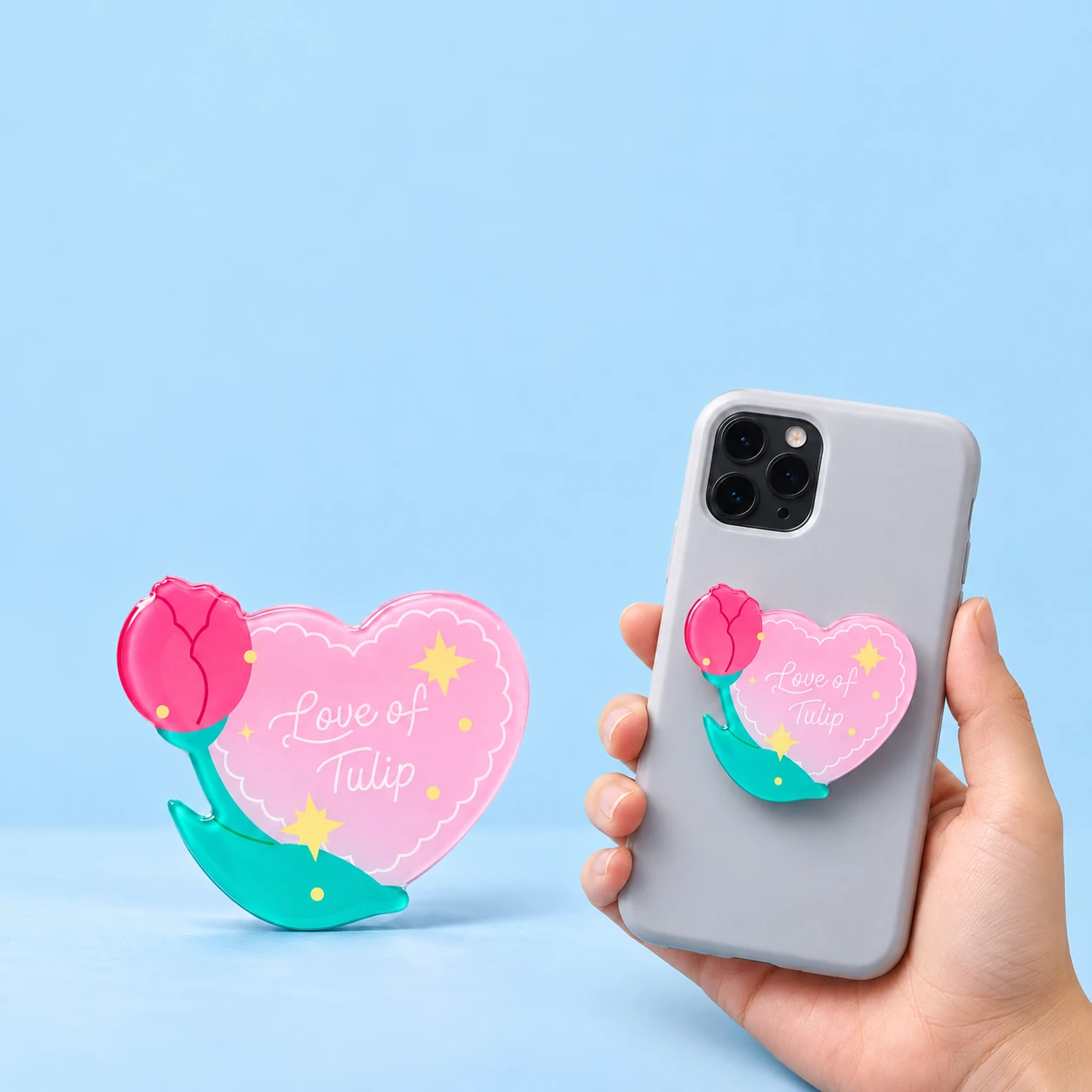 Pink tulip-heart expandable phone grip with original Love of Tulip print and closed phone placement, square composition