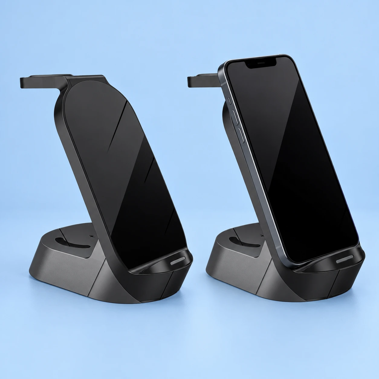Complete black rounded-wedge phone dock beside the same dock supporting a stationary black-screen phone on pale blue. Original curved lower rail, rear earbud well and top watch shelf retained. Charging requires suitable external power; cable and adapter inclusion are unconfirmed.