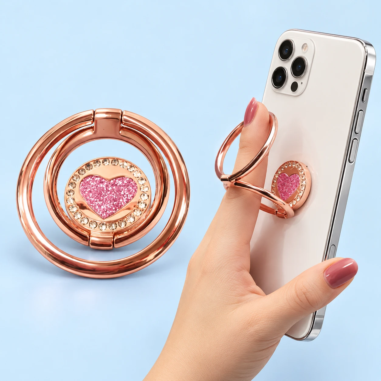 Rose-pink heart-disc phone ring with two original serial hinged rings, shown complete and in source-supported finger use.