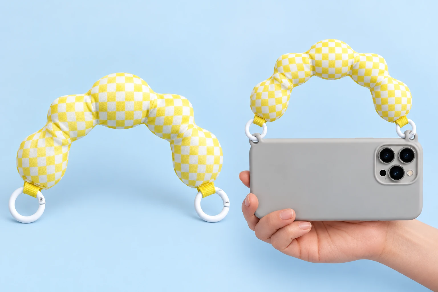 Yellow-and-white check five-lobed padded phone handle with two original white round gates, shown complete on the left and directly attached to two integral case eyelets on a hand-supported phone on the right. Phone and case not included.
