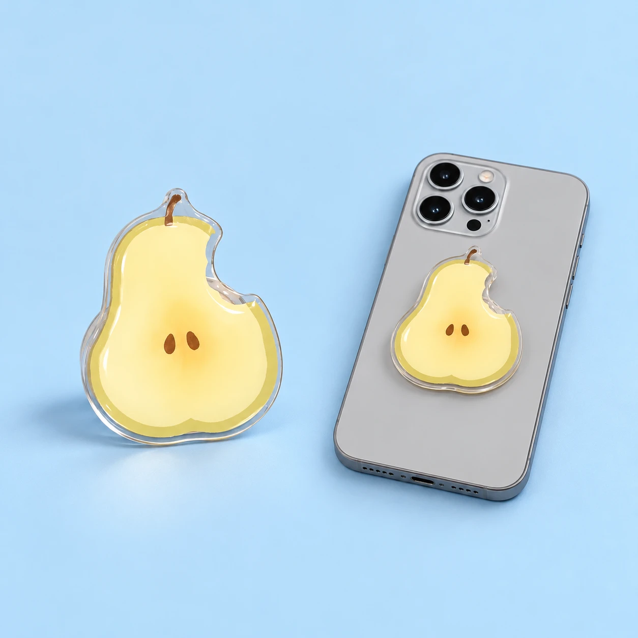 Pale yellow bitten-pear expandable phone grip and closed phone-back mounting illustration, square composition