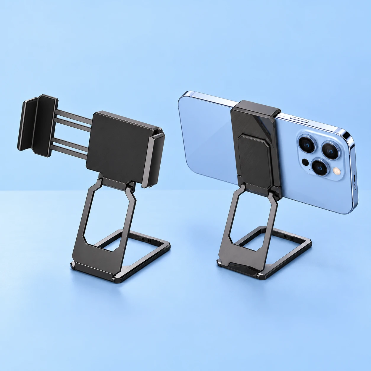 Black Nested-Frame Clip-On Phone Back Stand; product and illustrative use on pale blue. Phone and scene props excluded., square composition