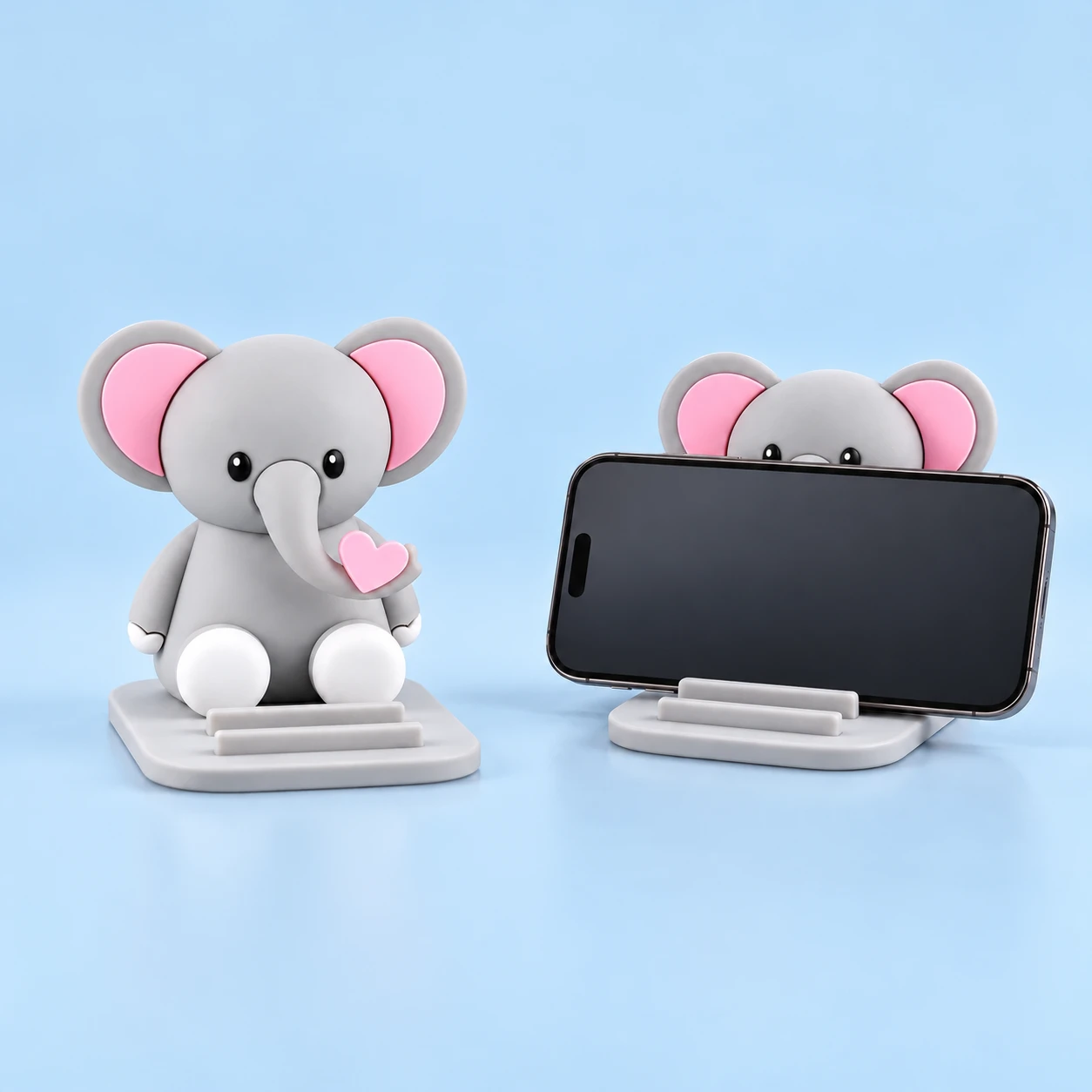 Gray Heart-Holding Elephant Two-Position Phone Stand shown alone and in illustrative phone use, square composition