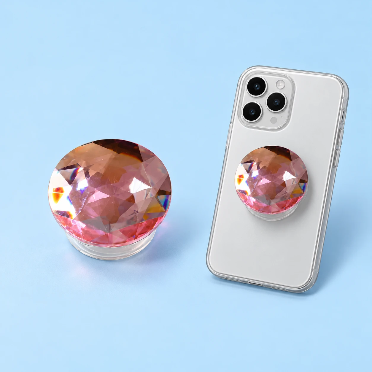 Pink faceted round decorative phone grip with clear base and closed mounting illustration, square composition