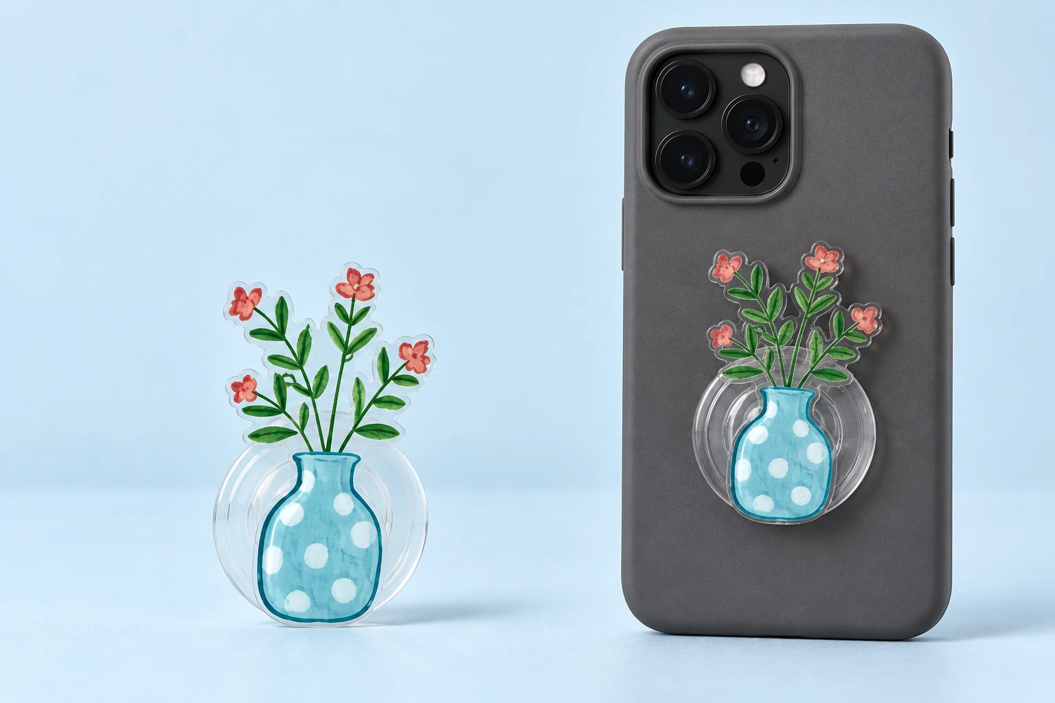 Blue polka-dot vase with four pink flowers expandable phone grip on a transparent circular base