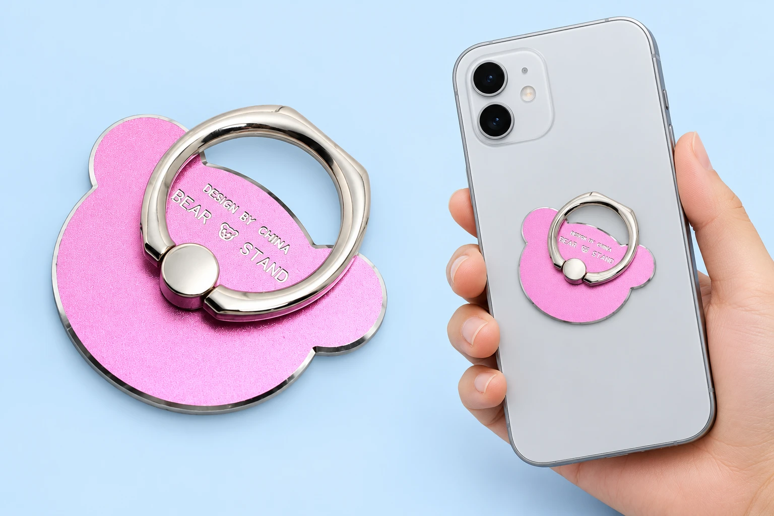 Pink metal bear-head phone ring with small round ears, shown complete and closed on a hand-supported phone with rear fixing hidden