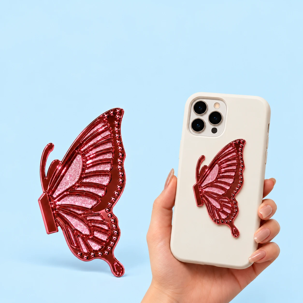 Rose pink half-butterfly phone kickstand shown complete and closed on a phone case, square composition