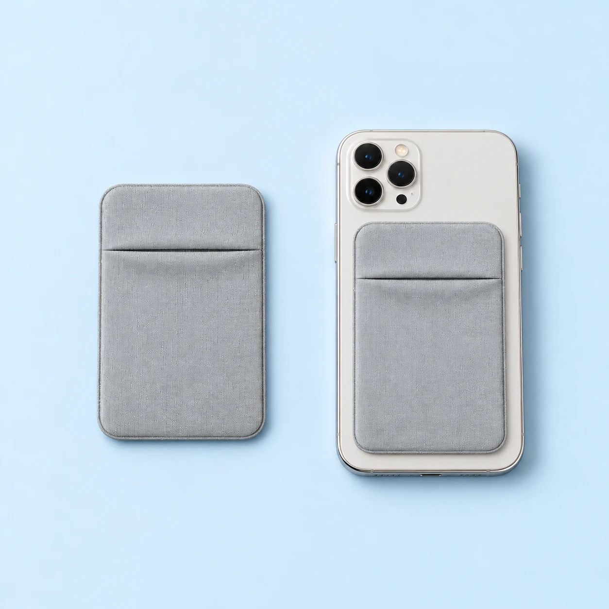 Gray overlap-top phone card pocket shown empty alone and mounted flat on a stationary phone, with the attachment interface hidden, square composition