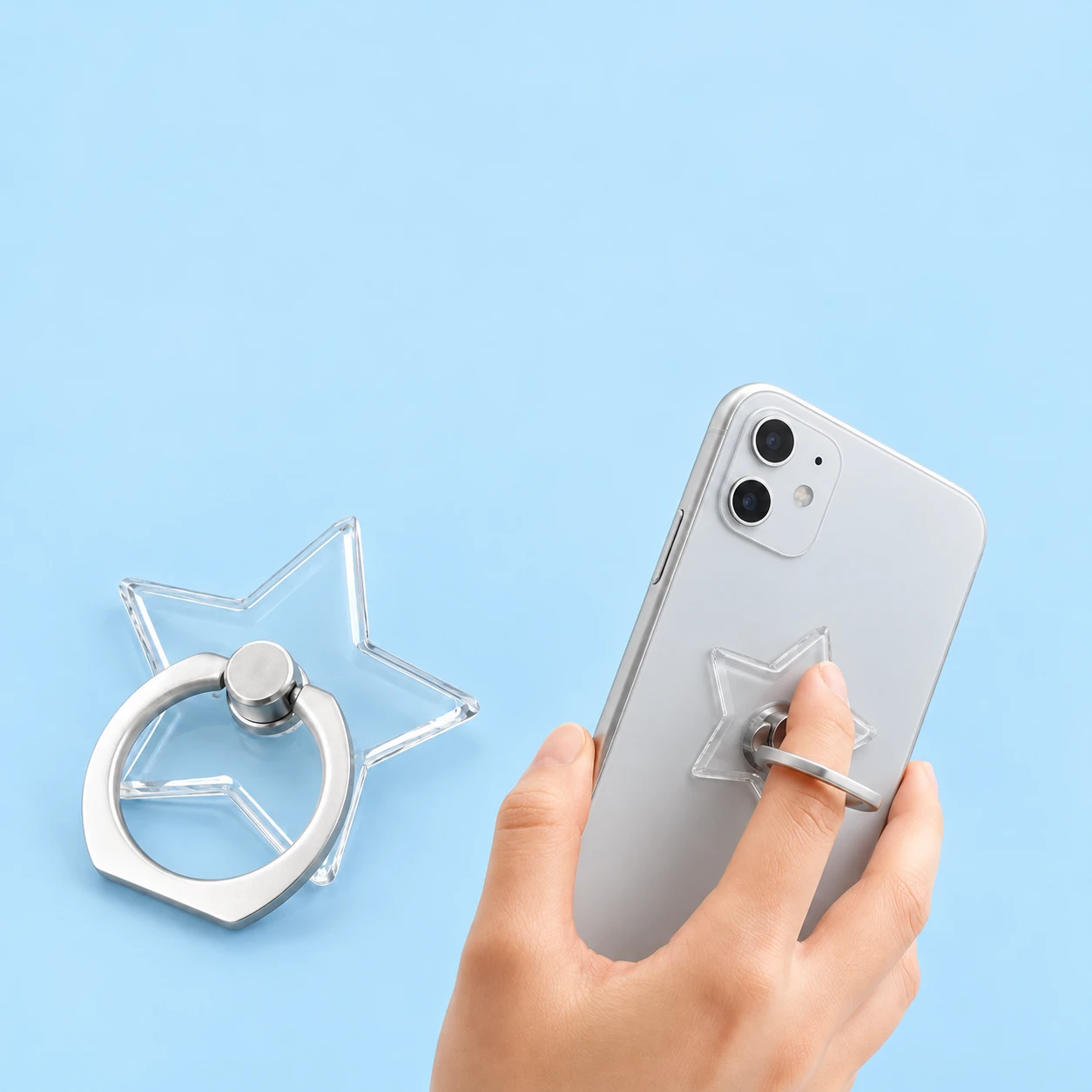 Clear five-point star phone ring holder shown complete and in finger-grip use, square composition
