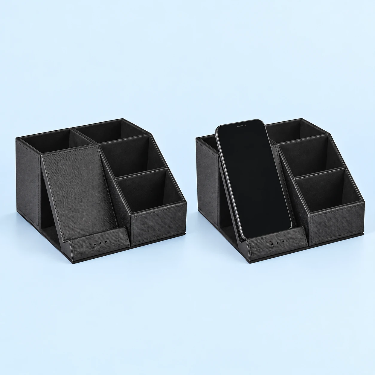 Black Multi-Compartment Organizer Phone Charging Stand; product and illustrative use on pale blue. Phone and scene props excluded., square composition