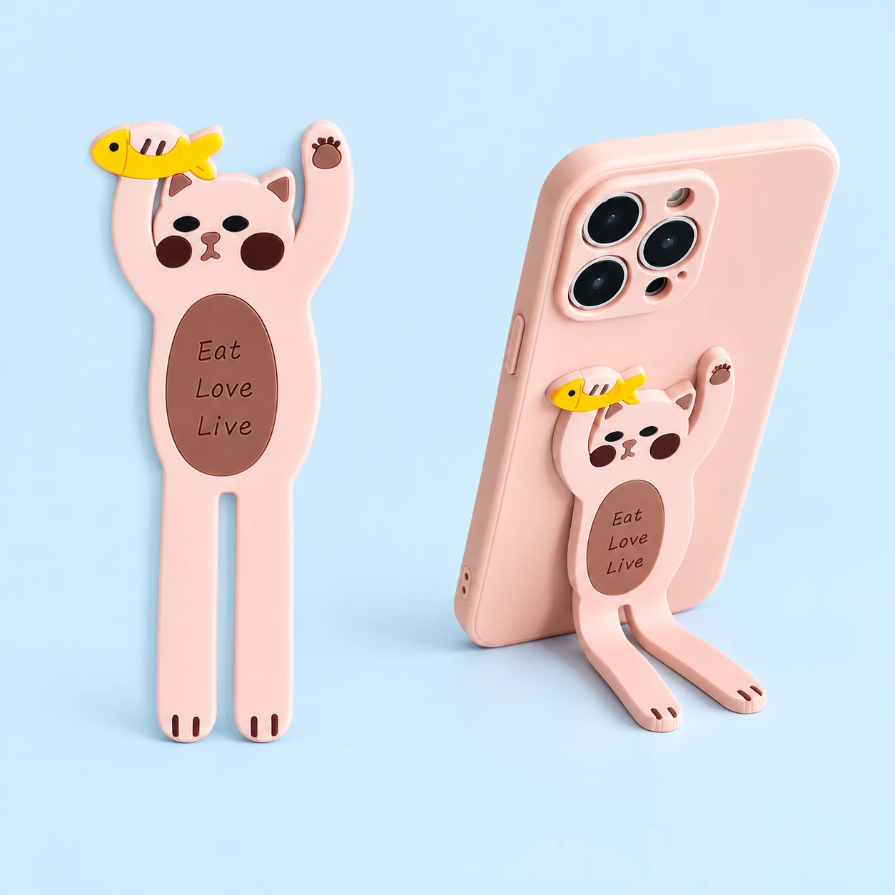 Pink fish-holding cat bendable phone kickstand on pale blue, complete product on left and portrait phone support on right; phone and case not included