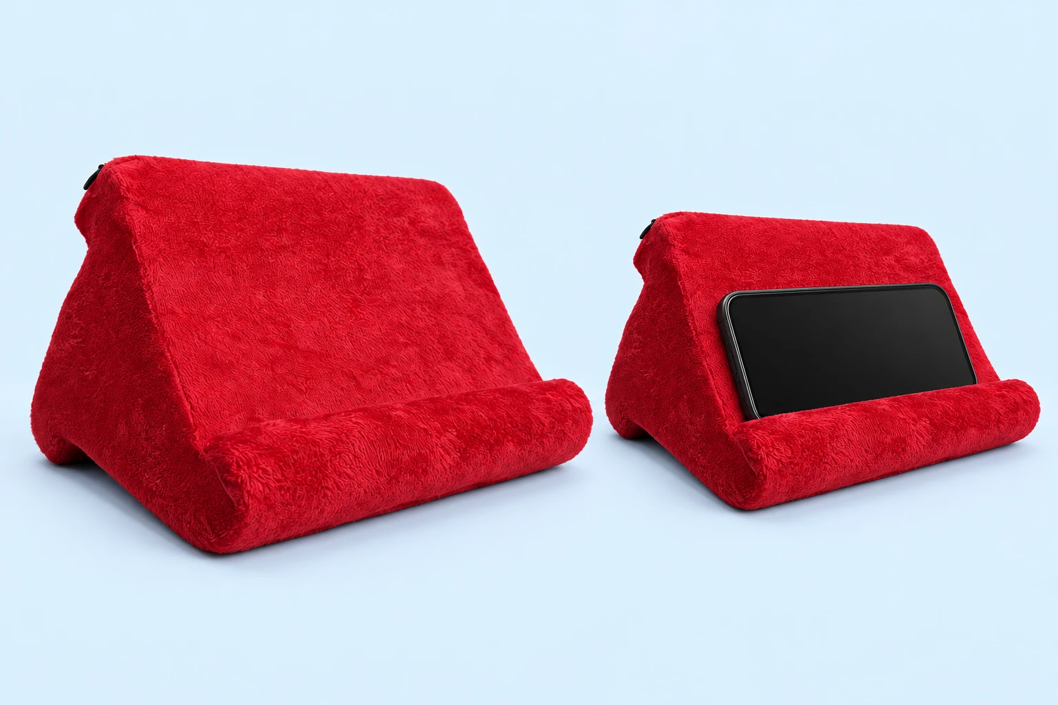 Complete red cloth-covered three-lobed foam phone cushion without a pocket, beside an intended landscape-phone use illustration behind the original retaining roll on pale blue; phone not included.