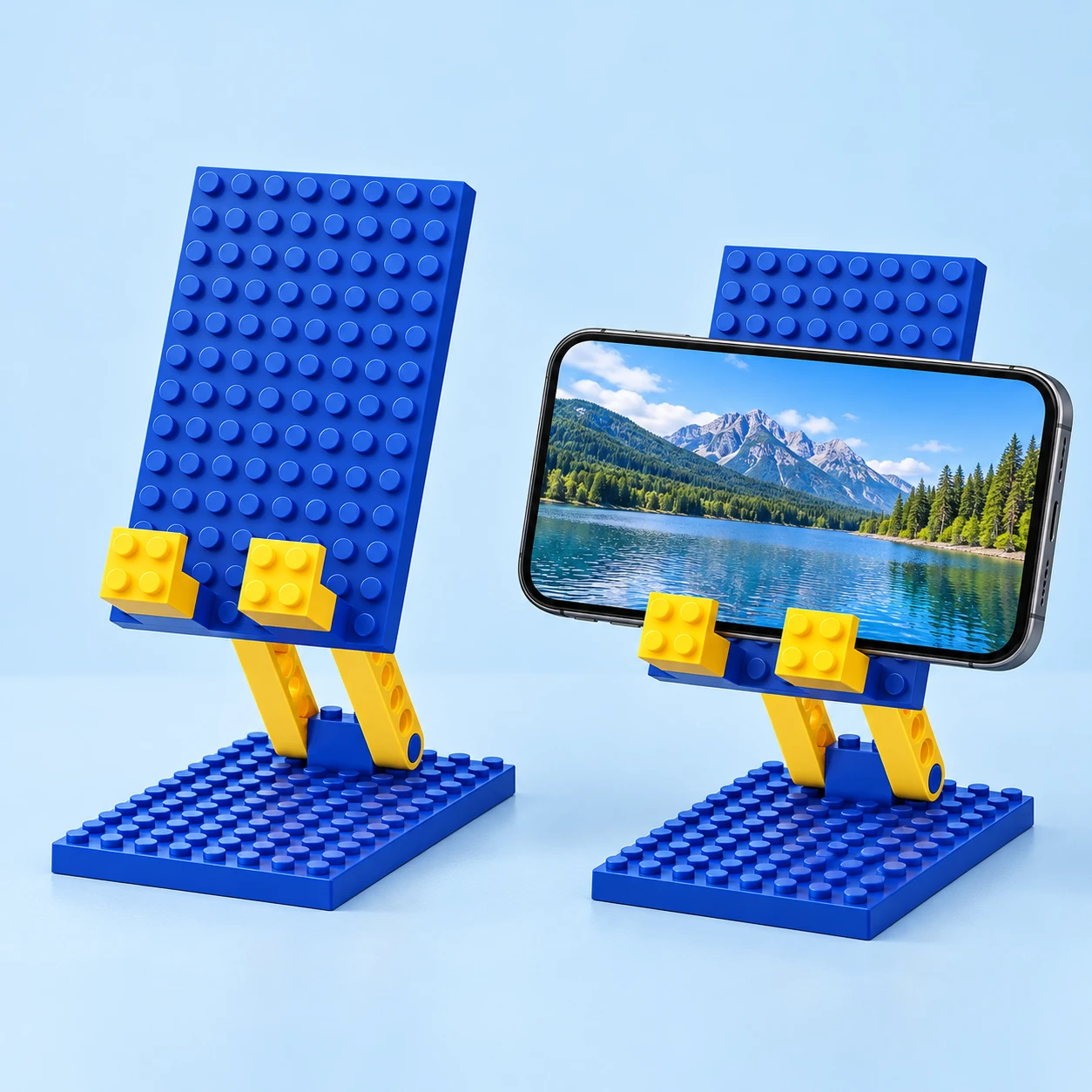 Blue and yellow studded folding phone stand, isolated and supporting a landscape phone; two views of one item